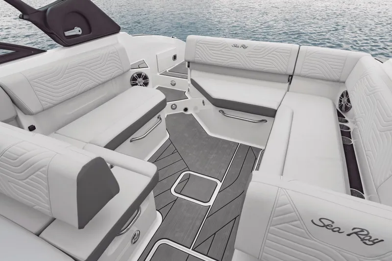Slide: The Image of The image shows the luxurious cockpit of a Sea Ray SDX 270 Surf with elegant white upholstery. - 18