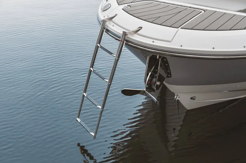 Slide: The Image of A 2027 Sea Ray SDX 270 Surf with an extendable swim ladder at the stern. - 16
