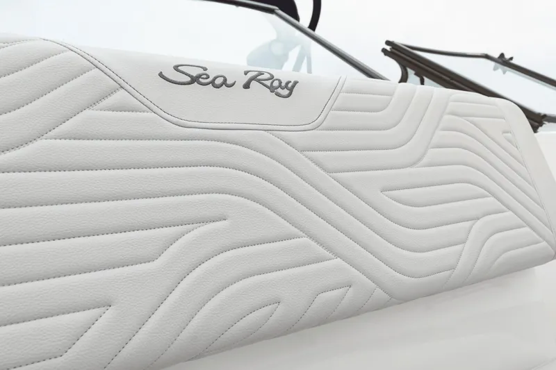 Slide: The Image of Close-up of a white textured upholstery with the Sea Ray logo. - 35