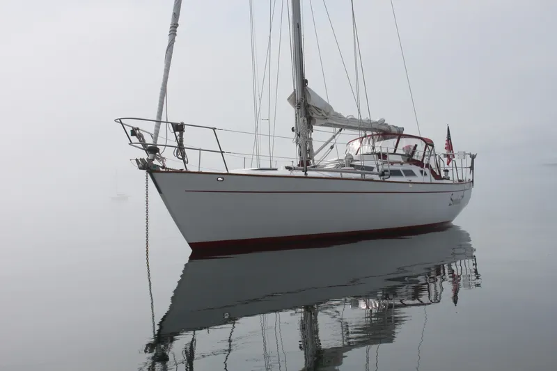 The Image of Sailboat "Fair Weather Mariner 39" from 1989 on calm, misty waters. - 0