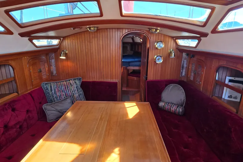 Slide: The Image of Luxurious 1989 Fair Weather Mariner 39 yacht interior with plush seating and wooden accents. - 16