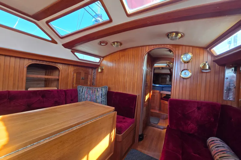 Slide: The Image of Luxurious 1989 Fair Weather Mariner 39 yacht interior with plush seating and wooden accents. - 15