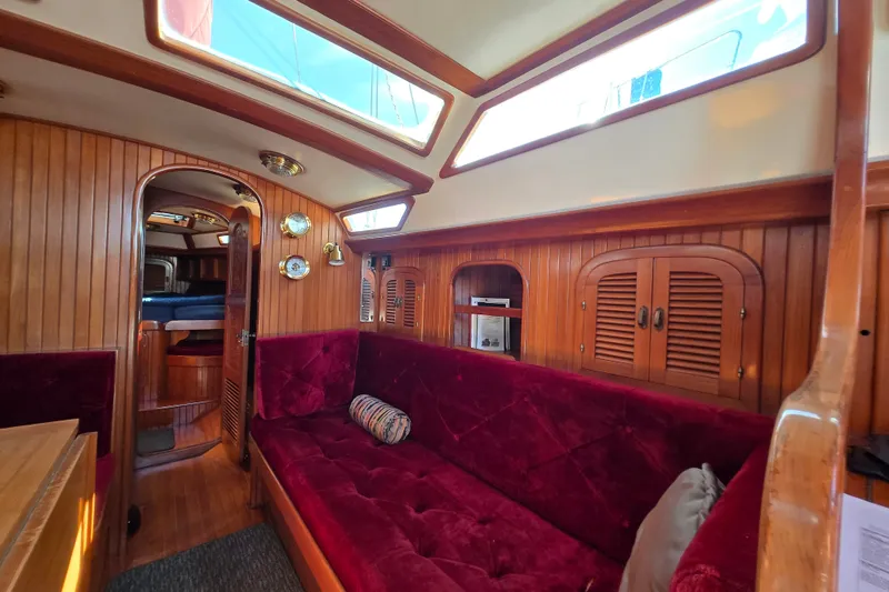 Slide: The Image of Luxurious 1989 Fair Weather Mariner 39 yacht interior with plush seating and elegant wood paneling. - 17