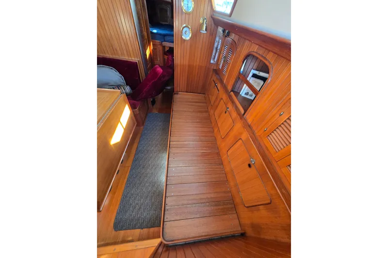 Slide: The Image of Interior of 1989 Fairweather Mariner 39 yacht with wooden cabinetry and seating. - 23