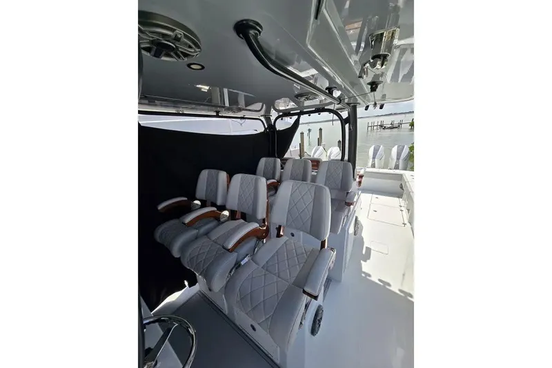 Slide: The Image of Luxurious seating on 2024 Freeman 47 boat, featuring elegant design and waterfront view. - 8