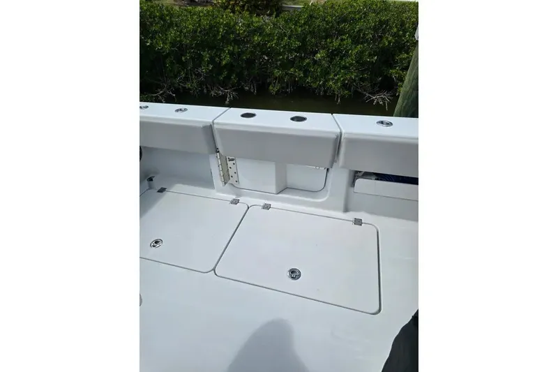 Slide: The Image of 2024 Freeman 47 boat deck with storage compartments and sleek design. - 15