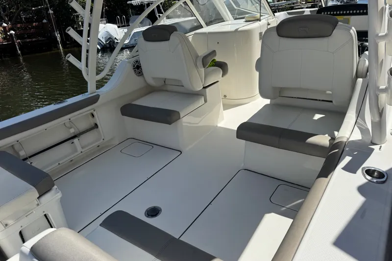 Slide: The Image of 2022 World Cat 296 DC boat interior with comfortable seating and modern design. - 10