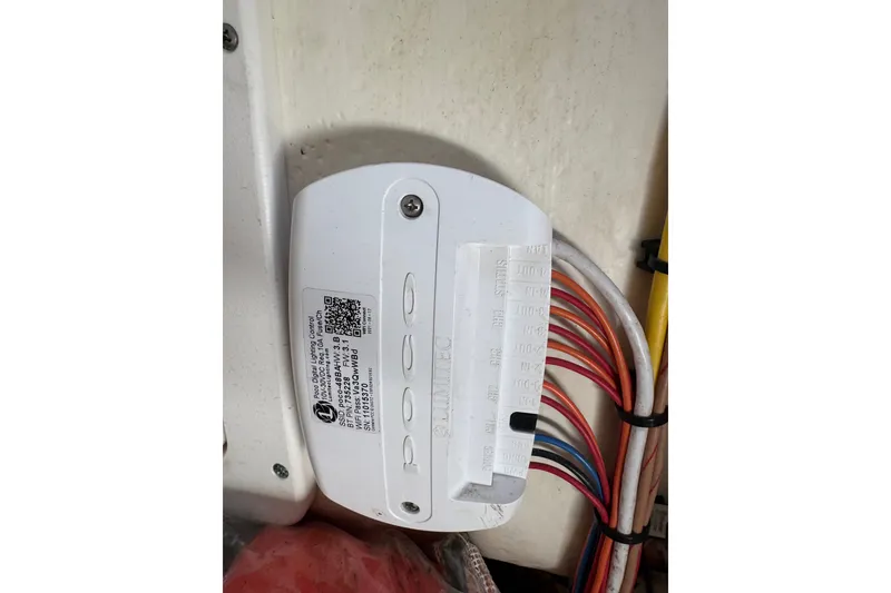 Slide: The Image of Electrical component with wiring inside a 2022 World Cat 296 DC boat. - 33