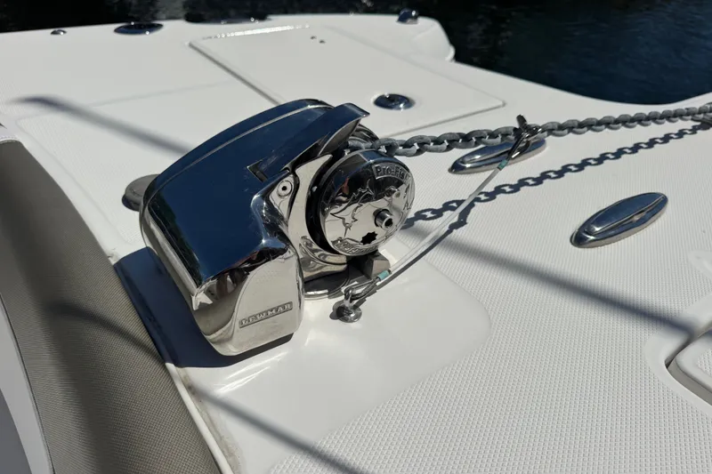 Slide: The Image of Anchor winch on 2022 World Cat 296 DC boat deck, featuring polished chrome finish. - 28