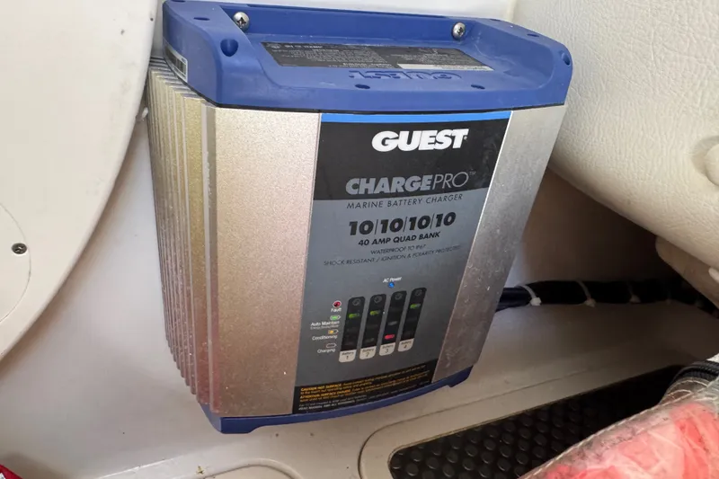 Slide: The Image of Marine battery charger in a 2022 World Cat 296 DC boat, featuring Guest ChargePro. - 32