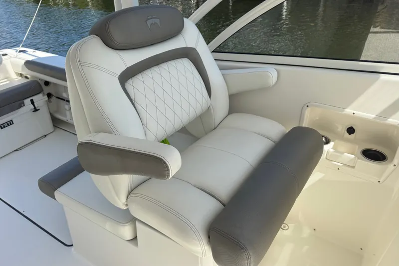 Slide: The Image of Luxurious seating on 2022 World Cat 296 DC boat, featuring elegant design and comfort. - 11