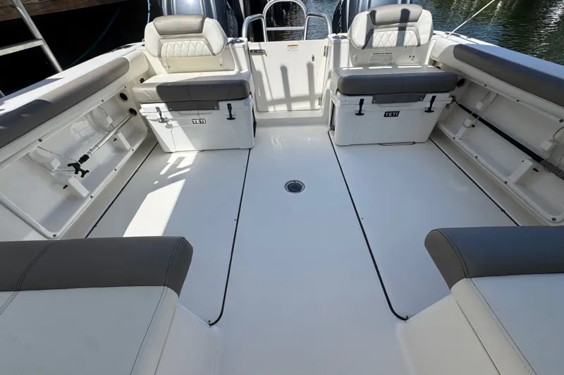 Slide: The Image of Spacious interior of 2022 World Cat 296 DC boat with seating and storage. - 7