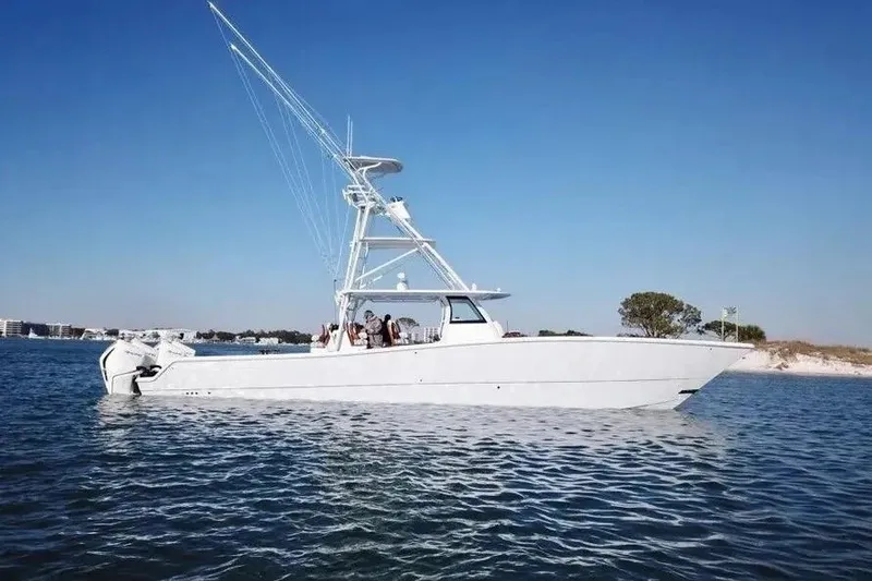 Slide: The Image of 2023 Freeman 47 boat on calm water under clear blue sky. - 4