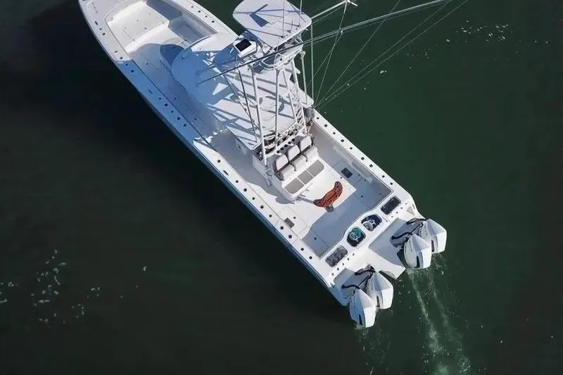 Slide: The Image of Aerial view of 2023 Freeman 47 boat with multiple outboard engines on water. - 8