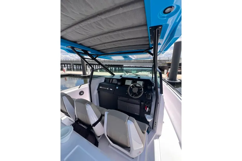 Slide: The Image of 2023 Axopar Brabus 37 Sun-Top boat interior with modern helm and seating. - 54