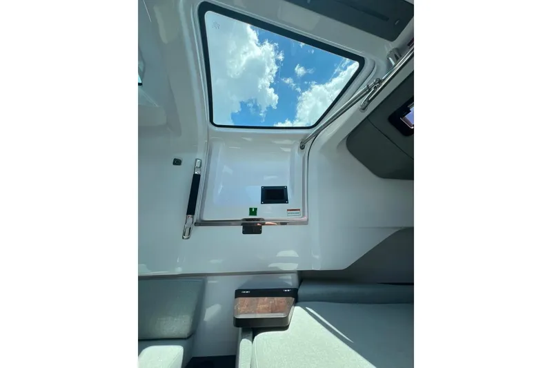 Slide: The Image of Interior view of 2023 Axopar Brabus 37 Sun-Top with skylight and seating. - 14