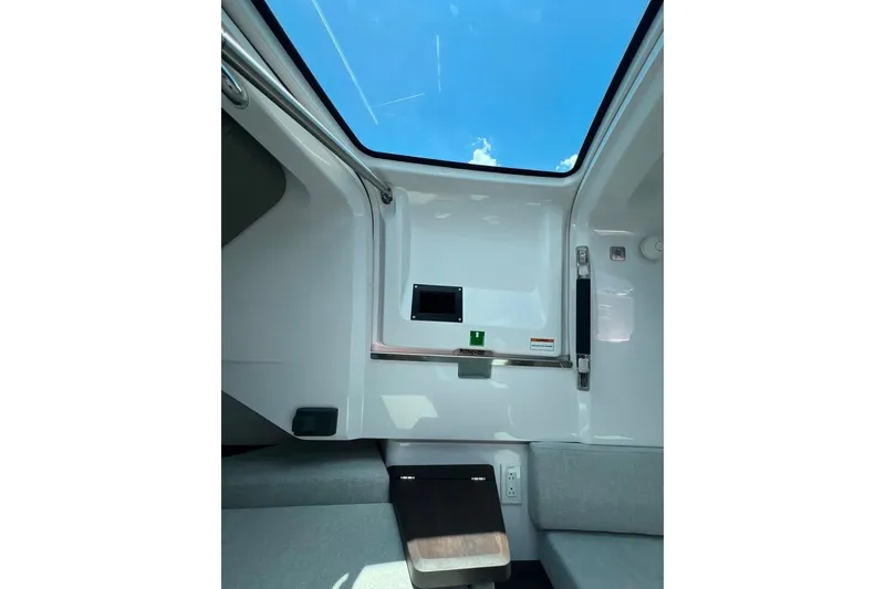 Slide: The Image of Interior view of 2023 Axopar Brabus 37 Sun-Top with skylight and modern design elements. - 16