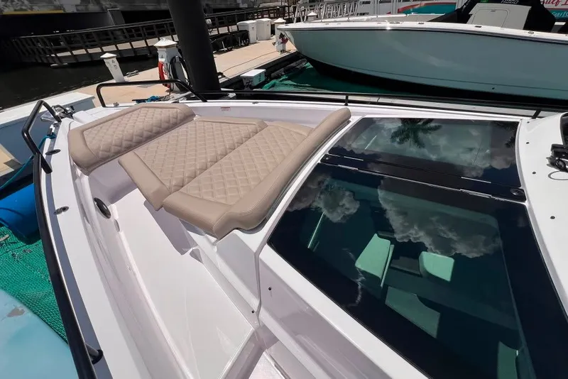 Slide: The Image of 2023 Axopar Brabus 37 Sun-Top boat with cushioned seating and sleek design. - 66