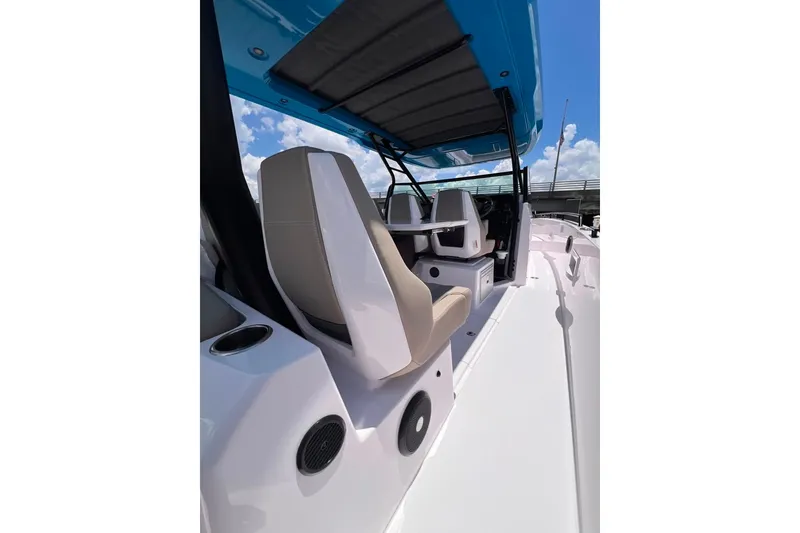 Slide: The Image of 2023 Axopar Brabus 37 Sun-Top boat interior with seating and canopy. - 27