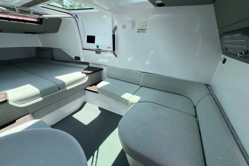 Slide: The Image of Interior of 2023 Axopar Brabus 37 Sun-Top, featuring sleek seating and modern design. - 26