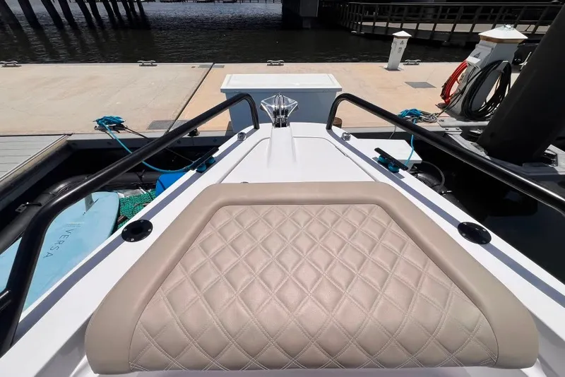 Slide: The Image of 2023 Axopar Brabus 37 Sun-Top boat interior with quilted seating at dock. - 64