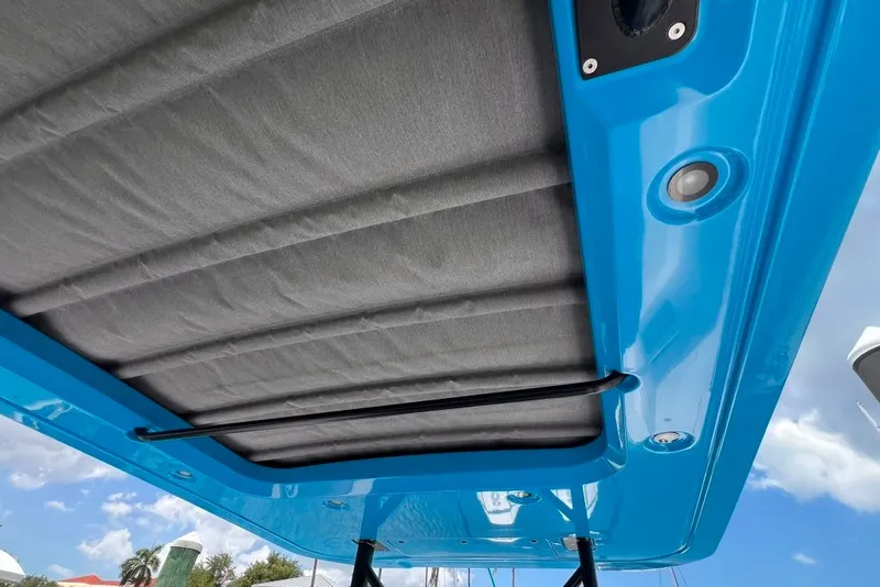 Slide: The Image of 2023 Axopar Brabus 37 Sun-Top boat roof with blue trim and integrated lighting. - 35
