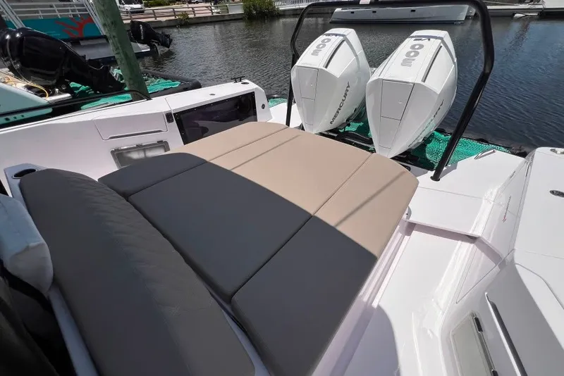Slide: The Image of 2023 Axopar Brabus 37 Sun-Top with dual Mercury outboard engines and cushioned seating. - 49