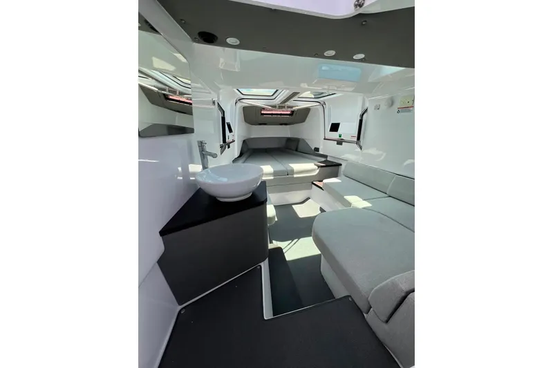 Slide: The Image of Luxurious interior of 2023 Axopar Brabus 37 Sun-Top with modern seating and sleek design. - 20