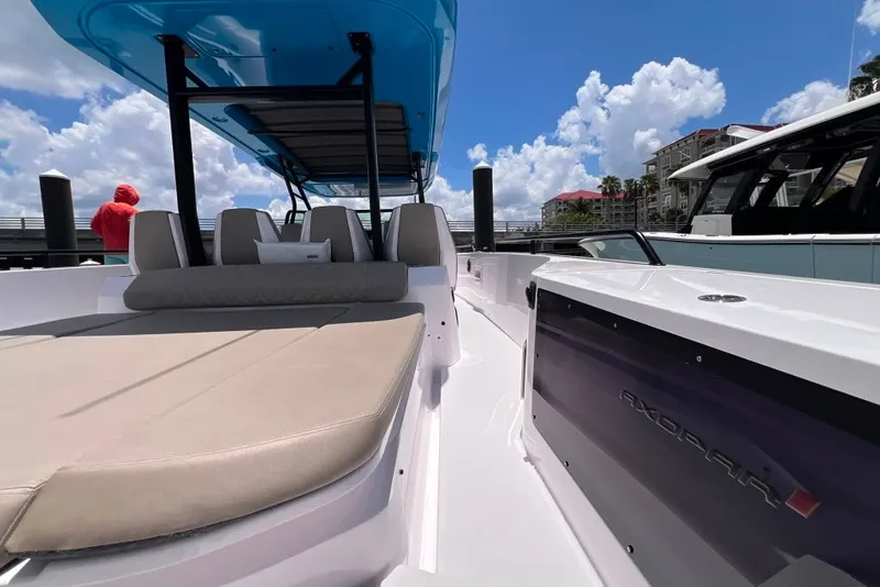 Slide: The Image of 2023 Axopar Brabus 37 Sun-Top boat with sleek design and spacious seating. - 24