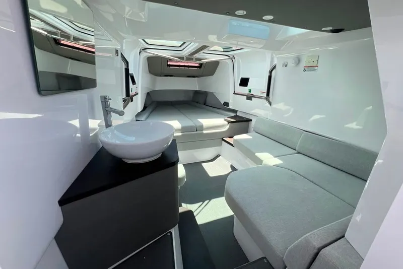 Slide: The Image of Luxurious interior of 2023 Axopar Brabus 37 Sun-Top with modern seating and sleek design. - 22