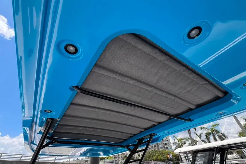 Slide: The Image of 2023 Axopar Brabus 37 Sun-Top with blue canopy and integrated lighting. - 38