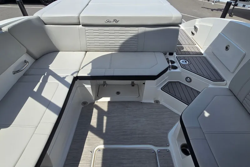 Slide: The Image of Luxurious interior of 2023 Sea Ray SPX 230 boat with spacious seating and modern design. - 11