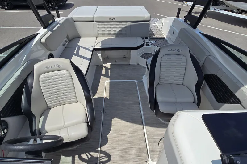 Slide: The Image of 2023 Sea Ray SPX 230 boat interior with luxurious seating and modern design. - 8