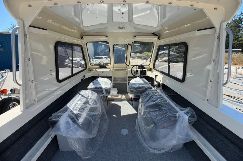 Slide: The Image of Interior of 2026 Hewescraft 200 ProV ET Hardtop boat, featuring spacious seating and helm. - 6