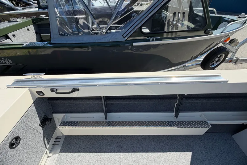 Slide: The Image of 2026 Hewescraft 200 ProV ET Hardtop boat interior with storage compartments and sleek design. - 10