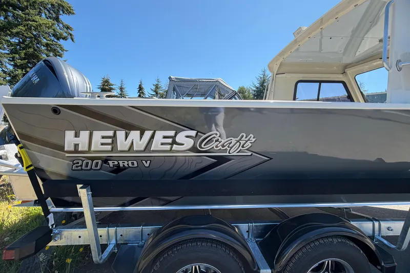 Slide: The Image of 2026 Hewescraft 200 ProV ET Hardtop boat on trailer, side view. - 4