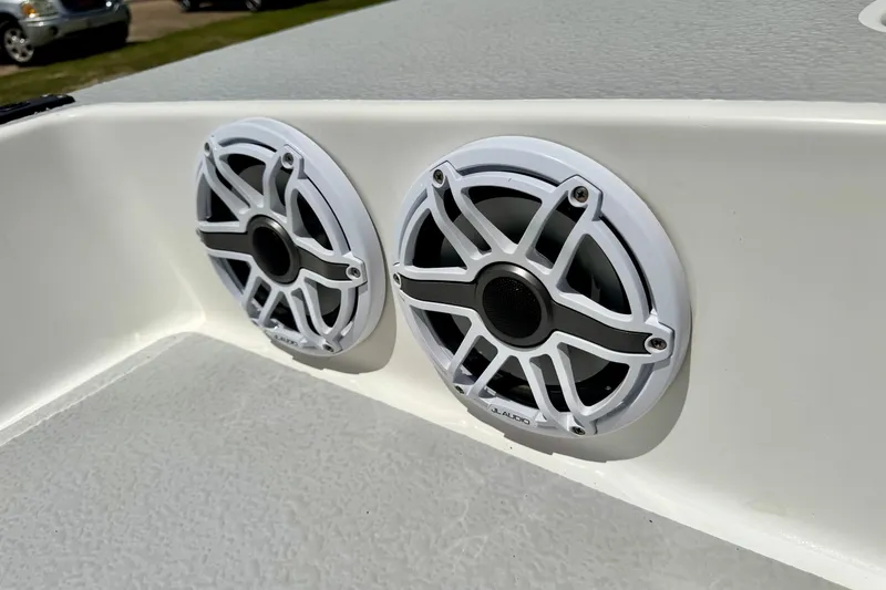 Slide: The Image of Dual JL Audio speakers on a 2021 SCB R24 boat, mounted on a white surface. - 19