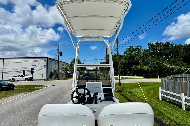 Slide: The Image of 2021 SCB R24 boat with Garmin navigation, parked on a sunny street. - 10