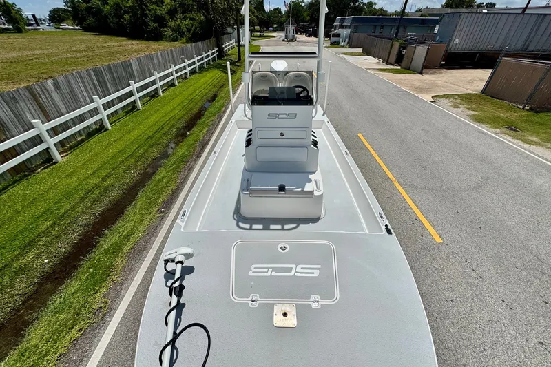 Slide: The Image of 2021 SCB R24 boat on a road, showcasing deck and console design. - 16