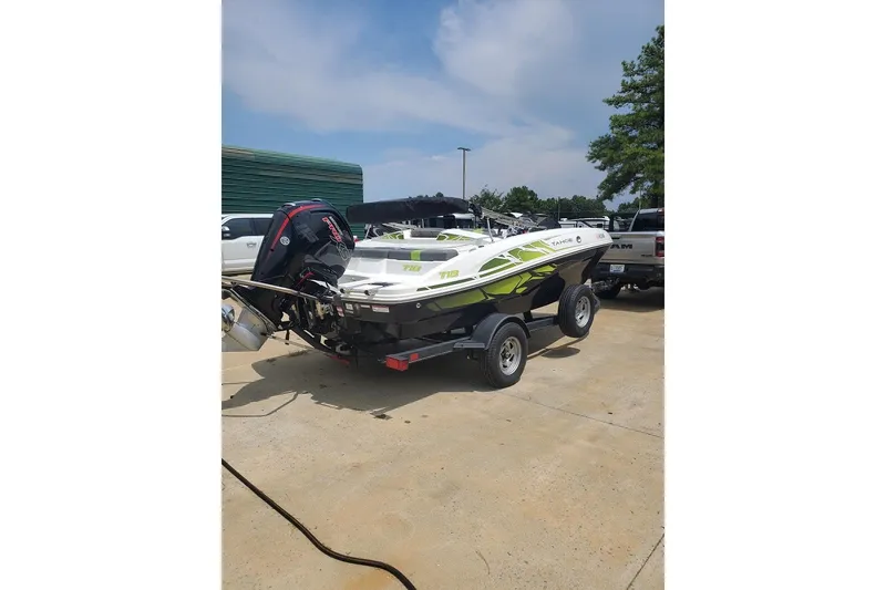 The Image of 2022 TRACKER MARINE T18 Bowrider on trailer, parked outdoors. - 1