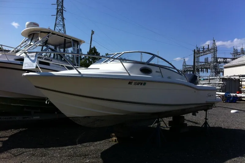 Slide: The Image of 2008 Scout 222 Abaco boat for sale, displayed outdoors on stands. - 1