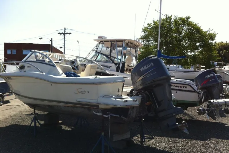 Slide: The Image of 2008 Scout 222 Abaco boat with Yamaha outboard motor in a marina setting. - 3