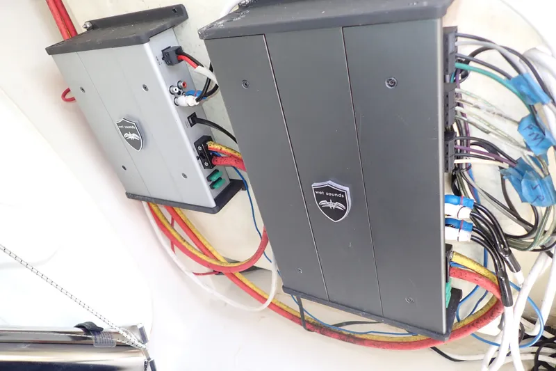 Slide: The Image of Electrical components and wiring inside a 2019 Sailfish 245 DC boat. - 98