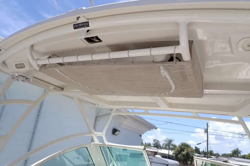 Slide: The Image of 2019 Sailfish 245 DC boat with overhead storage and action camera mount. - 84