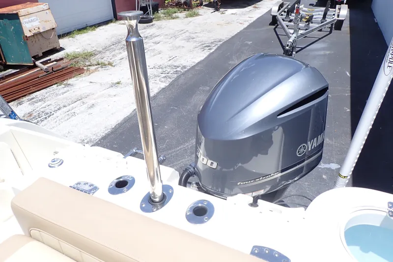 Slide: The Image of 2019 Sailfish 245 DC boat with Yamaha outboard motor and stainless steel rod holder. - 31