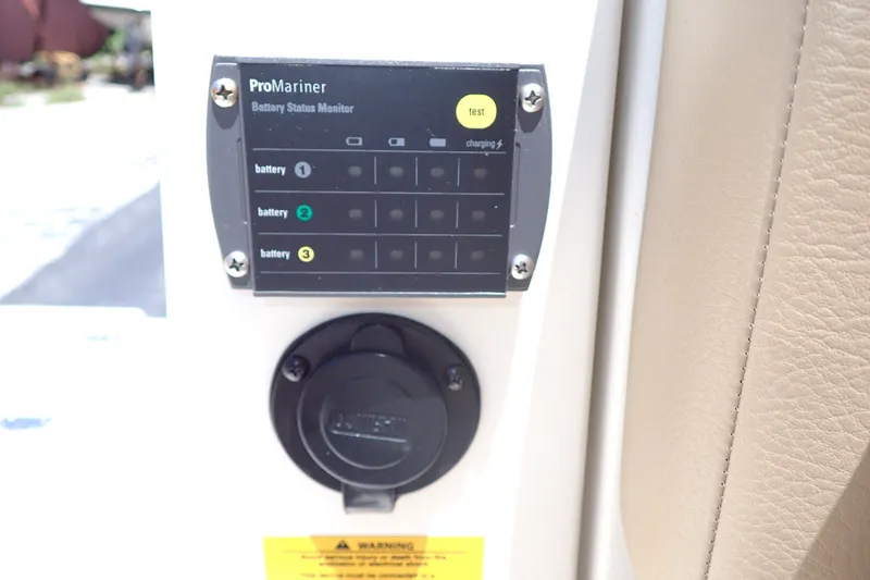 Slide: The Image of ProMariner battery status monitor on 2019 Sailfish 245 DC boat dashboard. - 68