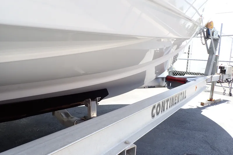 Slide: The Image of 2019 Sailfish 245 DC boat on Continental trailer, side view. - 120