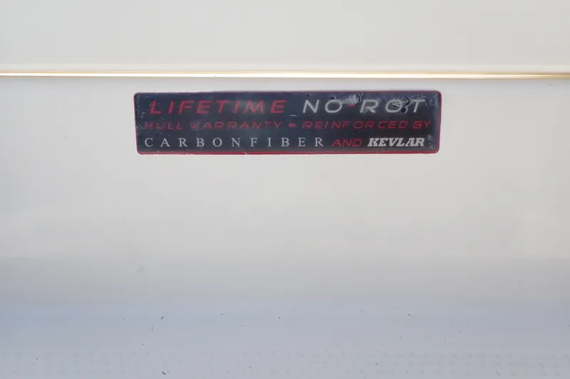 Slide: The Image of 2019 Sailfish 245 DC hull warranty label, reinforced with carbon fiber and Kevlar. - 130