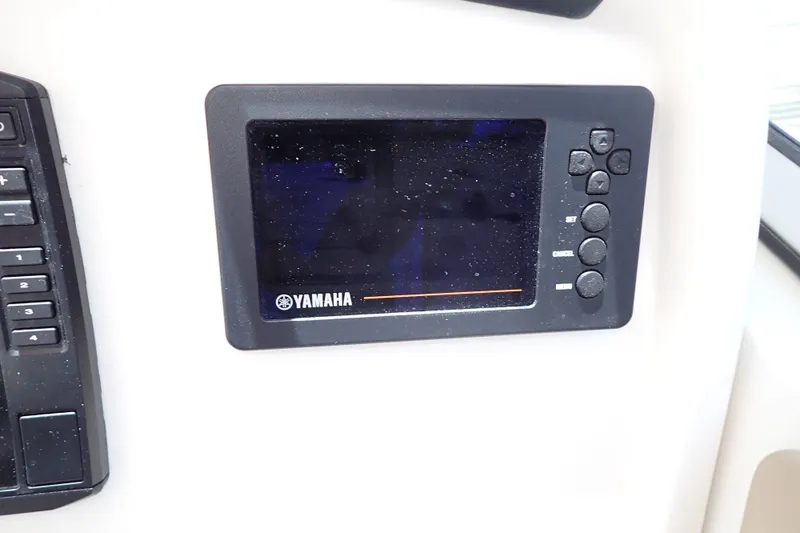 Slide: The Image of Yamaha display panel on 2019 Sailfish 245 DC boat dashboard. - 23