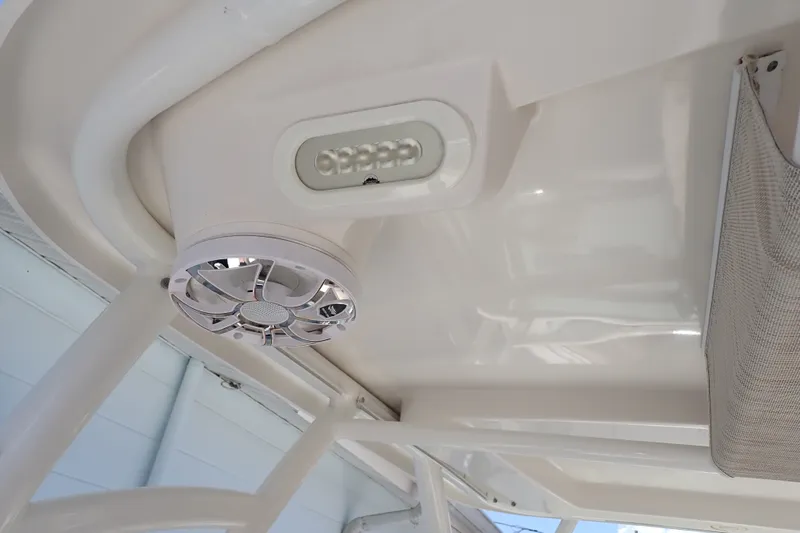Slide: The Image of 2019 Sailfish 245 DC boat interior ceiling with speaker and LED light. - 85